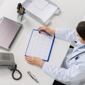 medicine-healthcare-cardiology-people-concept-doctor-with-cardiogram-phone-laptop-computer-sitting-table-clinic_380164-181653 Best Fertility Treatment in Patna