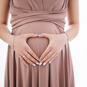 woman-hugging-lovely-pregnant-tummy-hands-shape-heart_159701-258 DR Smriti Sparsh